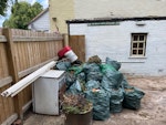 Fridge chair garden waste Under counter fridge, arm chair, plastic pots/ boxes, garden waste B30 - removed for £120