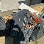 Bags of wood decking + pots Multiple bin linders of wooden decking ripped up from the garden. Bits of nails, wood, and some old garden machinery (broken). Plus a broken plant pot and old food waste bin. NW6 - removed for £100
