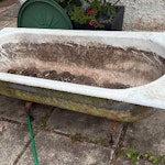 Bath, sofas, filing cabinet Cast iron bath heavy 10m away from road, 2 x sofa frames (no cushions), wooden filing cabinet. GU26 - removed for £190