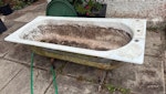 Bath, sofas, filing cabinet Cast iron bath heavy 10m away from road, 2 x sofa frames (no cushions), wooden filing cabinet. GU26 - removed for £190