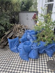 old deck and bags of rubble old deck (about 40 bars) and part of the frame as well. 
about 25-30 bags of rubble and soil.
some bigger pieces of cement slabs not in bags (about 20, not entire slab but bigger pieces) SW14 - removed for £350