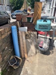Scrap wood, bedside table vari Scrap wood, folding garden chairs, bedside cabinet and various other small items. E7 - removed for £70