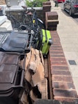 cardboard & junk luggage please collect the cardboard, 1 black garbage bag, and 1 green suitcase sitting out in front of my house stashed behind my garbage bins. E5 - removed for £50