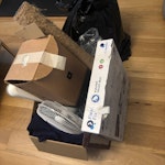 Box & bag of assorted rubbish Box of rubbish, including a fan, cat pole etc and box of coffee items; boxed unused toilet seat; bin bag of rubbish TW11 - removed for £40