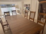 Solid oak table and 6 chairs Table size 180cm x 100cm basic size 
225cm x 100cm with table extension
Height of table is normal standard.  
Extension slots beneath when not in use. 6 chairs also solid oak. NW3 - removed for £0