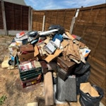 rubbish mainly books from loft rubbish from loft in garden ready to remove. access to garden from gate straight to road CM18 - removed for £120