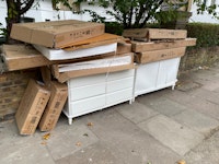 Chest of drawers and cardboard collected by waste management group