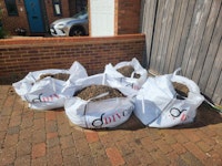 4 * 500l bags 2/3 full of soil collected by On The Job Waste Management