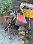 Broken garden furniture Broken wooden furniture and a plastic box SW16 - removed for £80