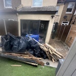 There is an assortment as list 18 x rubble bags of rubble
3 x assorted general waste
3x black bags of plastic balls
1 set of car runners
loose stone tiles approx 20
1 marble hearth
small pile of wooden beams
A few loose plastic Facia SE19 - removed for £240