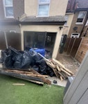There is an assortment as list 18 x rubble bags of rubble
3 x assorted general waste
3x black bags of plastic balls
1 set of car runners 
loose stone tiles approx 20
1 marble hearth 
small pile of wooden beams 
A few loose plastic Facia SE19 - removed for £240