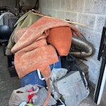 Pile a rubbish in garage It’s a mixture of dirt, wood, old chairs, old carpet etc NP15 - removed for £300