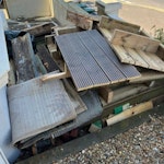 Old decking/wood + 2x old rugs This is old decking from our back yard. It's too big and too much for us to remove with our car. There are lots of screws in it still, so you would need to be careful when removing it. BN2 - removed for £100