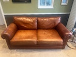 Large leather sofa This is a well loved brown leather sofa, but it is perfectly useable and being replaced because we are redecorating. The only damage are two small tears underneath the left seat cushion. LS17 - removed for £85
