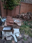 Clutter Boxes and Lino Floor 2 boxes of household clutter. 
3 rolled up lengths of old lino flooring. 
Some polystyrene packaging. SE20 - removed for £60