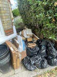 a mix of general waste I have a smashed up wardrobe/ kitchen units, 3 bags of cardboard and 9 bags of general waste- all accessible from the front garden and there is a loading bay that is free for one hour just near the house if needed . SW18 - removed for £150