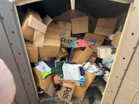 shed full of cardboard boxes collected by doos removals