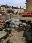 Building waste removal Building and gardening waste, already bagged. And pallet. Out the front of the house. E7 - removed for £185