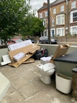 Boxes, junk and old toilet cardboard boxes, 2-3 builder waste bags, old toilet (could be reused if needed) wash basin pedestal, bath panel, kids skate W9 - removed for £150