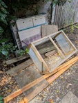 planks of wood, cold frame some old planks of wood from a raised bed, a cold frame which could be reused, dismantled small wooden playhouse, small roll of roof felt and a small outdoor rug. would all fit in a large car/ small van. You can park on our drive to load, easy access through to the back garden, no steps. E17 - removed for £100