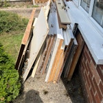 Mostly wood-based waste. 11 doors (3 with glazing, which may not meet current standards). Cast-offs from kitchen renovation. Apart from the glazing and some short lengths of copper pipe, all is wood-based. PE30 - removed for £195