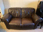 Two seater leather sofa Two seater leather sofa in good condition. W150cm, D80cm, H90cm. W14 - removed for £85