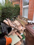 wood & miscellanious wood, suitcases, a sofa cover, vacuum cleaner, buckets E17 - removed for £200