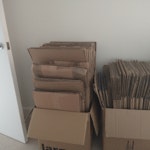 Cardboard removal boxes (c.80) Reusable cardboard removal boxes flattened and stacked in 8 boxes.(around 10 flattened boxes to a box) for easy removal (see photos). Also 1 cardboard garment carrier with plastic rail and 11 separate flattened book boxes. All take up approx 5ftx5ft floor space. To be collected from 4th floor flat with good-size lift. Parking for 'white van'. CR8 - removed for £80