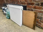 2 radiators, worktop & others two radiators (one old but one still in good use), a piece of worktop that can be reused, a plank of mdf, and a bag of hard plaster. The load is in the garden and I will help to move it outside for easy load NW10 - removed for £90