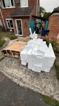 Cardboard and polystyrene Flattened cardboard boxes (for tvs/gadgets) and the polystyrene that came in them. All on the front drive and easily accessed from road. CB21 - removed for £200
