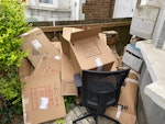 Packing boxes + chair A number of empty cardboard boxes (not reusable - have been rained on). One empty suitcase and one office chair. NW2 - removed for £75