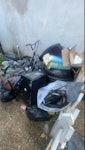 shed junk small bbq small mini fridge bike gram black bags old junk cardboard boxes empty small fan little fish tank EN3 - removed for £105