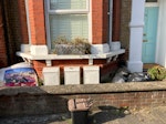 Primarily gardening waste Various bits of household waste, primarily gardening waste, but some cardboard/packaging and some stray bits of wood. NOTE: flower boxes on window ledge and flower pots on ground are NOT to be taken as part of collection SW9 - removed for £50