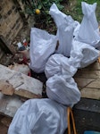9 bags of tiles/rubble + wood 9 bags of broken tiles, tile adhesive, etc.

Each likely weighs 20kg - easily to lift.

Some plywood, chipboard scraps too and timber lengths. SW14 - removed for £95