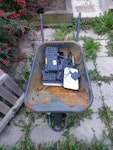 wheelbarrow and electronics old wheelbarrow filled with old and broken electronics and cables S6 - removed for £40