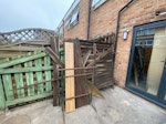 Old fence, palets, gypsum, etc Three 6feet broken fence panels, gypsum in green bags, general builder waste in rubble sacks, two wooden pallets, one radiator, one small basin, one cistern, wooden panel off cuts, etc. (the steel stand is not part of the waste) E3 - removed for £265