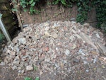 Rubble and scrap from garden Junk dug out of the garden - mostly bricks. I've tried to keep the larger pieces visible (some fence post and tiles). Also some scrap and old wood. N7 - removed for £430