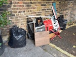Misc house rubbish 2 bin bags, buggy and bike seat, box of misc W6 - removed for £160