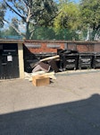 Dumped carpets A number of dumped carpets and an armchair blocking the bins. E3 - removed for £90