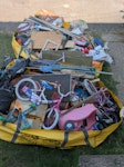 Garage and garden clearance Rubbish cleared from garage and garden.  Some wood, some toys, DVDs, clothes etc.  Fitting in to two Hippo Skip bags.  We do live in a walkway but access is easy along the walk way and bags are on the front garden. ME8 - removed for £280