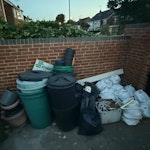 Garden and house rubbish All items in that photo, which include plastic bins, water butts, plastic pots, 9 rubble sacks with mixture of building waste and garden waste, finally a fridge freezer. SL3 - removed for £120