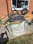 Bag cuttings chair wheelbarrow A builders bag full of garden cuttings, plus an old wooden garden chair and wheelbarrow ME19 - removed for £80