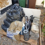 Bags of garden soil, bricks, o 10 sacks modestly filled with garden soil, 2 bags builders sand, 40 block paving bricks, 1 bag concrete (gone off), one pushchair, one wooden palet, piece of chipboard, bath end panel (plastic), 2 small chunks concrete rubble E17 - removed for £100