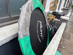 Bags of wood, plastic, metal 5 bags of wooden planks, plastic goods, metal poles and a trampoline base E9 - removed for £75