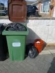 mixed waste contents of wheelie bin which is black bags of soil and green waste, plastic trays and pots plus pots and black bags to the right of the wheelie bin BN10 - removed for £45