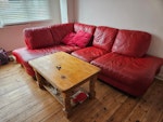 Sofa, 3 tables, mattress, junk Moving house and can't take this stuff with us - 
Red leather L-shape sofa, pine coffee table, antique round wooden and glass table, bedside table, wooden CD tower, small rug for under coffee table, single mattress, double mattress, pick axe, broken cupboard, plastic box and some other junk seen in the outdoor photo. KT3 - removed for £180