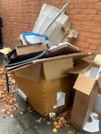 cardboard, chair and suitcase mostly cardboard plus two suitcases and broken chair TW1 - removed for £50
