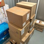 Cardboard boxes of unused PPE Boxes of expired vinyl gloves, face shields, test and trace kits and other PPE. BH11 - removed for £145