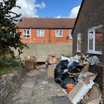 Builders waste Old kitchen (dismantled) including dishwasher, washing machine & oven. Fibreglass bath, bagged rubbish, cardboard & packaging. Scrap: stainless steel sink, copper pipe, 3 radiators. SW2 - removed for £250