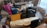 mixed household items. Hardly used single mattress,  1 disassembled swivel recliner and two foot stools,  1 rolled up king size bed topper,  foam pieces, storage bag of pillows, two large sofa cushion inserts, small rug,  storage bag of (bedding curtains and a few baby clothes), bag of backpacks, bag of lunch boxes, two lap trays. RG12 - removed for £200